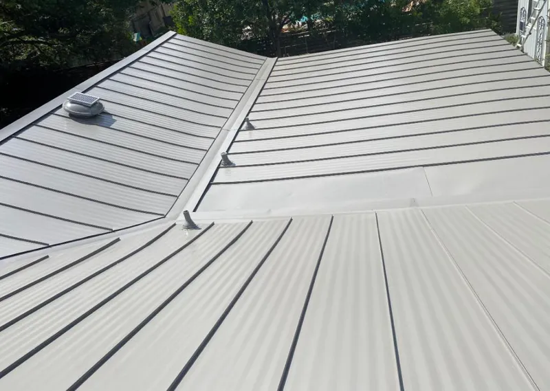 Solar attic fan installed on a metal roof for Roof Ventilation in Miramar